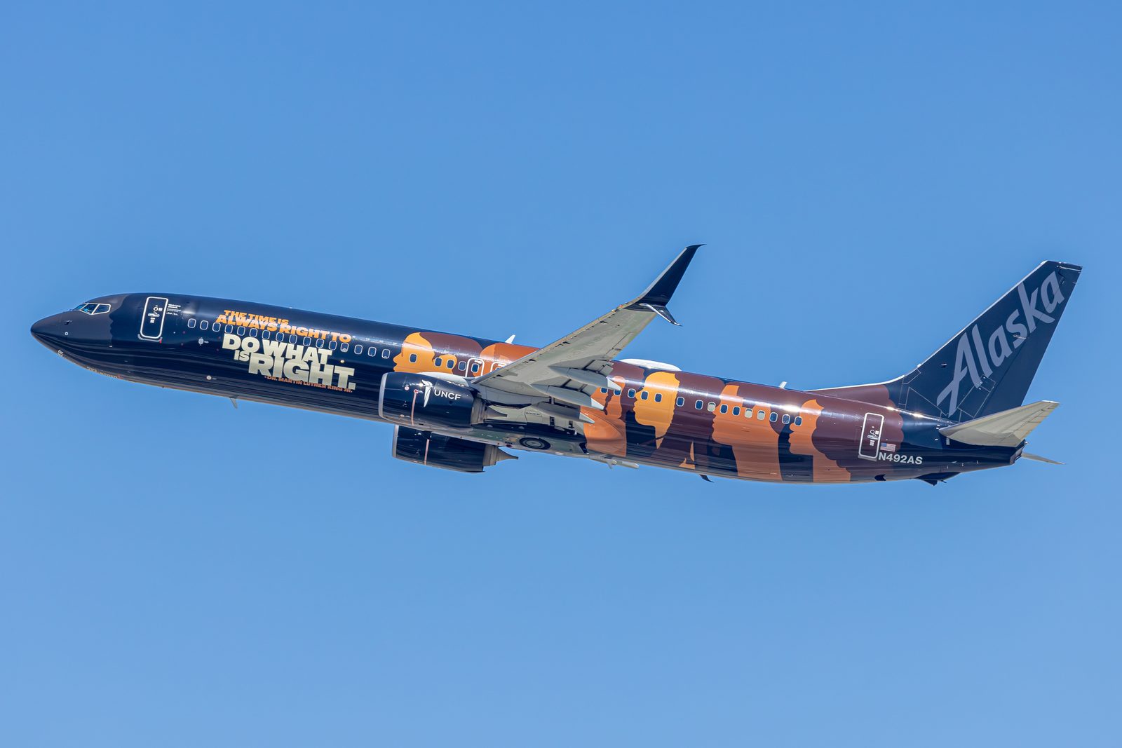 Alaska Airlines Boeing 737-900ER in a dark special livery climbing away from Los Angeles International.