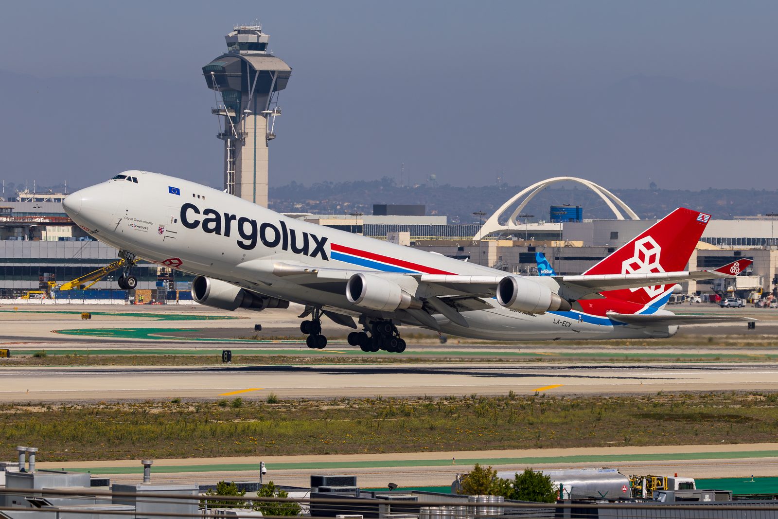 Cargolux Boeing 747 freighter accelerating past the Los Angeles control tower and Theme Building.