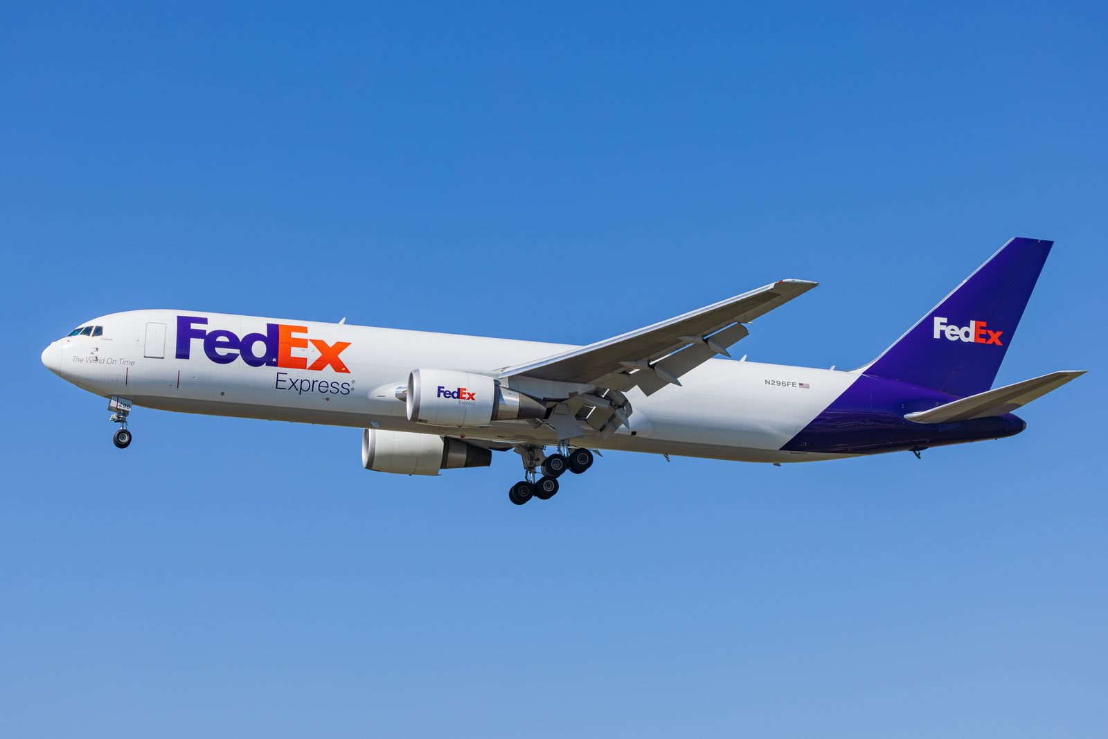 FedEx Express Boeing 767 freighter approaching Los Angeles International against a clear sky.